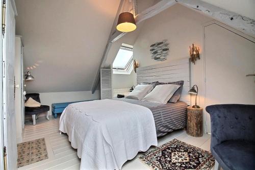 En eller flere senge i et værelse på La chambre du capitaine