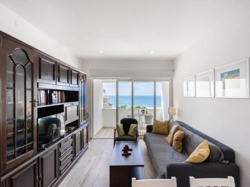 a living room with a couch and a table at Apartment Casa Avó Lucy by Interhome in Portimão