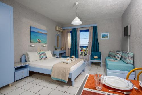 Postel nebo postele na pokoji v ubytování Latania Apartments