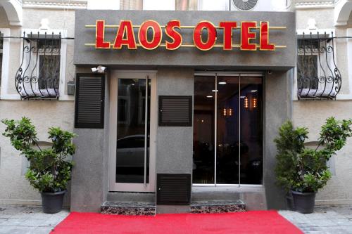 a restaurant with a red carpet in front of a store at LAOS OTEL in Istanbul