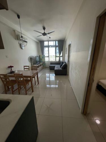 a large living room with a table and a couch at Heart of Petaling Jaya near LRT Line 5 (8) in Petaling Jaya