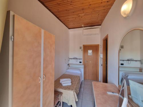 a bathroom with a shower and a washing machine at Hotel Marina in Riccione