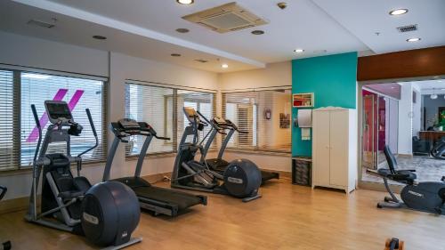 a gym with treadmills and elliptical machines at Barut B Suites in Side