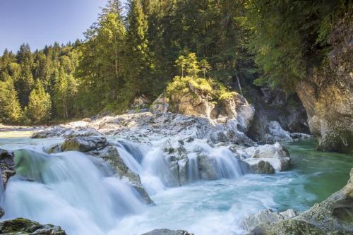 a waterfall in the middle of a river at Hausbergerhof Gästehaus Ainberger in Brixlegg