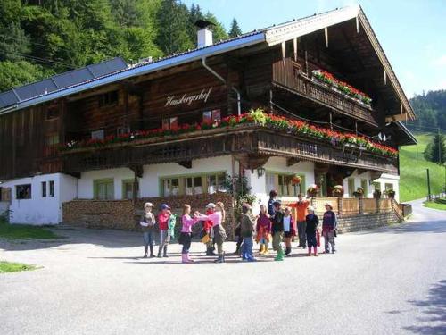 a group of people standing in front of a building at Hausbergerhof Gästehaus Ainberger in Brixlegg