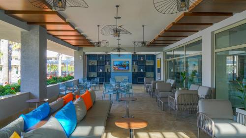 a lobby with a couch and tables and chairs at Barut B Suites in Side