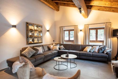 a living room with a couch and a table at Chalet Hochkrimml 43 in Krimml