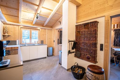 a kitchen and dining room in a log cabin at Chalet Hochkrimml 43 in Krimml
