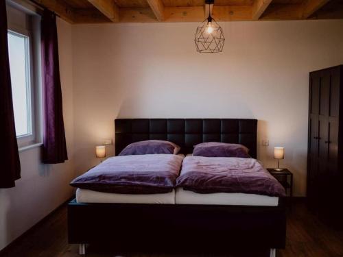 Una cama o camas en una habitación de Rheinzeit-Weisweil