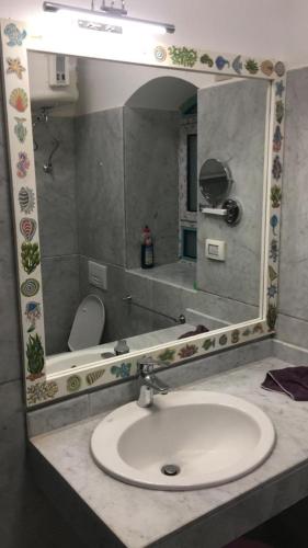 a bathroom with a sink and a mirror at j16 in Hurghada