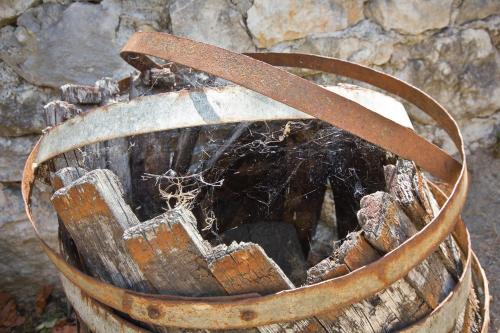 a wooden bucket with a strap on top of it at Sailor's Rustic House in Virpazar