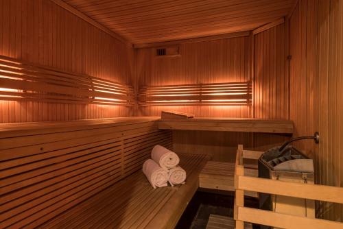 a sauna with two rolled towels in it at Hotel Bristol in Geneva