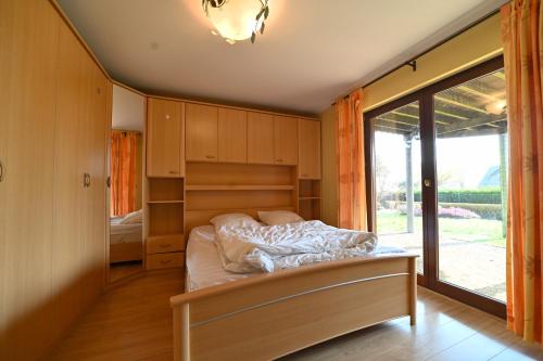Giường trong phòng chung tại Le Hibou