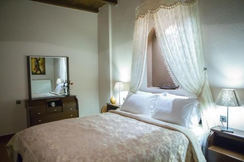 Postel nebo postele na pokoji v ubytování Ξενώνας Χαγιάτι