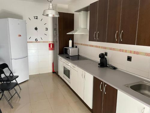 Virtuvė arba virtuvėlė apgyvendinimo įstaigoje Casona de flores ll