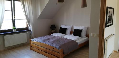Postel nebo postele na pokoji v ubytování Apartament na Deptaku w Łęcznej