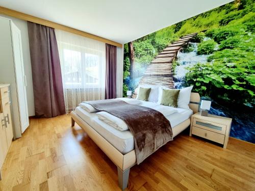 een slaapkamer met een muurschildering van een trap bij Apartment Burger in Dobbiaco