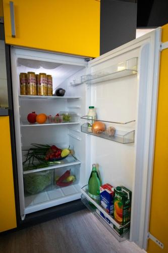 an open refrigerator filled with lots of food at Mali Nordsee Camp - DeLuxe Mobilehome in Pakoštane