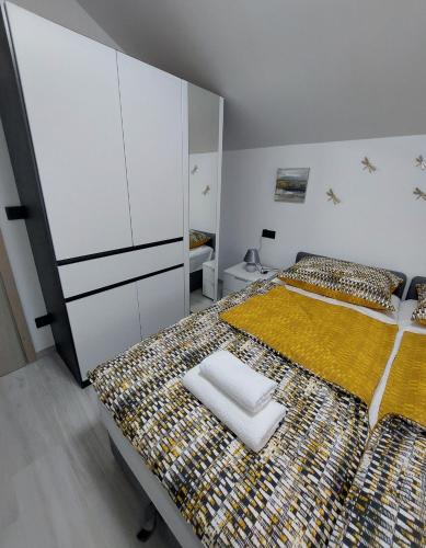 Postel nebo postele na pokoji v ubytování Apartmani Magić