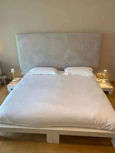Postel nebo postele na pokoji v ubytování Hotel Baia dei Pini
