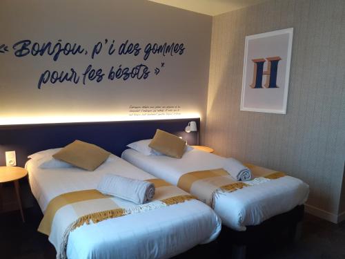 Katil atau katil-katil dalam bilik di Hôtel Antares & Spa