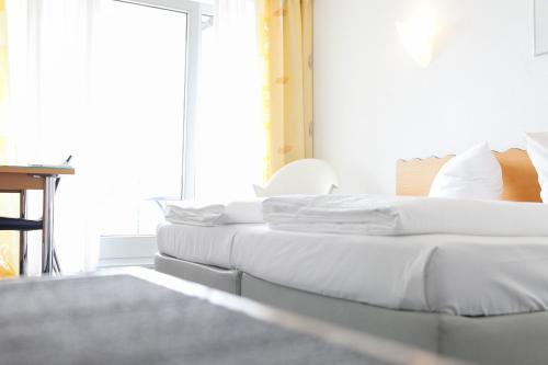Cama o camas de una habitación en Hotel Ambiente