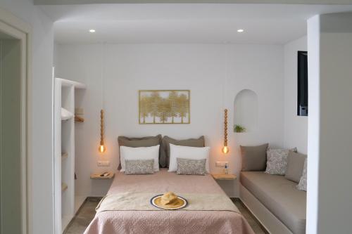 a living room with a bed and a couch at Theodora Luxury Studios in Naxos Chora