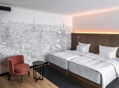 a bedroom with a drawing of a city at Pentahotel Rostock in Rostock