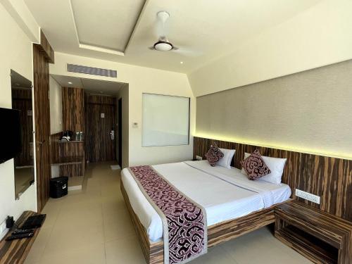 Katil atau katil-katil dalam bilik di Hotel Grand Parivaar