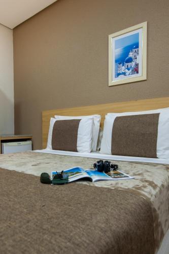 Postel nebo postele na pokoji v ubytování Hotel Olympia