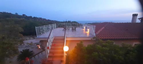 an overhead view of a building with a balcony at Villatramontistella Suite in Capoliveri