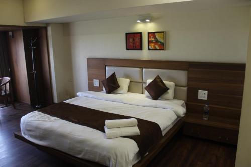 Postel nebo postele na pokoji v ubytování Hotel Sarvoday & Restaurant