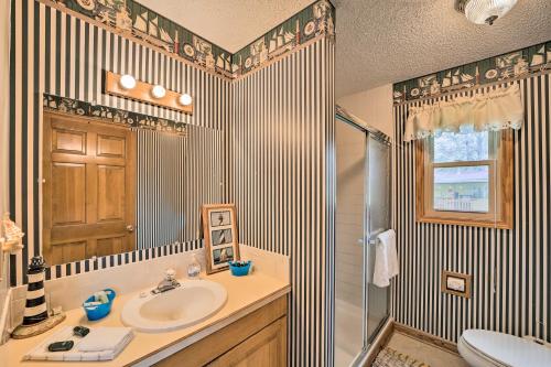 a bathroom with a sink and a shower at Kayaks and Boat Dock Waterfront Home in Grove in Grove