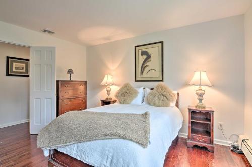 a bedroom with a bed with two stuffed animals on it at Lovely Highland Home with Pool and Hot Tub! in Highland