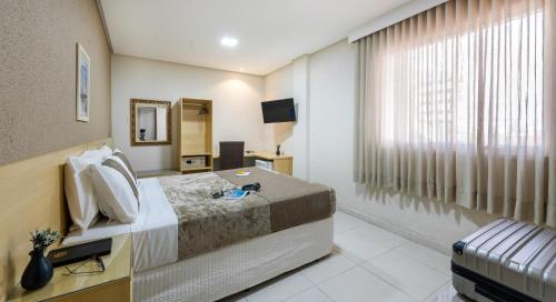 Postel nebo postele na pokoji v ubytování Hotel Olympia