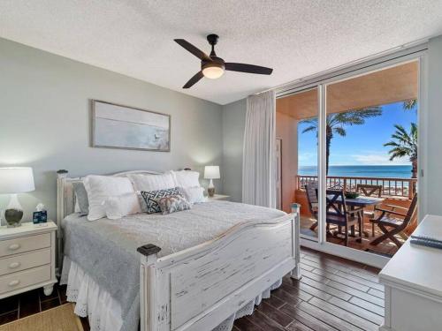 a bedroom with a bed with a view of the ocean at The Beach Club Doral 306 - Spacious Beachfront Condo! in Gulf Shores