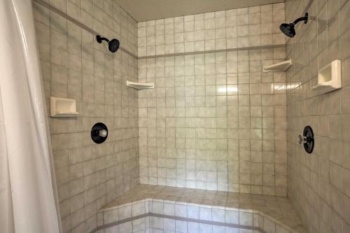 a bathroom with a shower with white tiles at 10 Acres with Stunning Views Apple Hill Home! in Camino