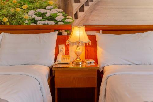 Giường trong phòng chung tại Giang Linh Hotel