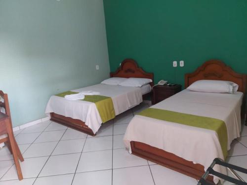 Postel nebo postele na pokoji v ubytování Hotel Takana