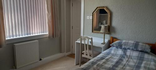 Postel nebo postele na pokoji v ubytování CORSBIE VILLA GUEST HOUSE