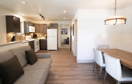 a kitchen and living room with a couch and a table at Tahoe Trail Resort in Stateline