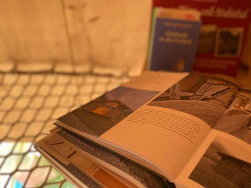 an open book sitting on top of a table at Stadlnest Moser in Neustift im Stubaital