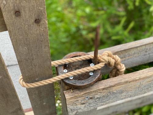 a piece of rope tied to a wooden fence at Stadlnest Moser in Neustift im Stubaital