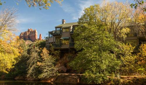 a house on the side of a mountain with trees at Inn Above Oak Creek Sedona in Sedona