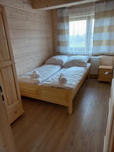 Postel nebo postele na pokoji v ubytování Domki Widokowe Panorama Tatr