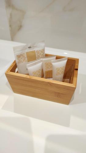 a wooden tray filled with differentiatesiatesiatesiatesiatesktop at Villa Manto Bed and Breakfast - Torre Annunziata Pompei in Torre Annunziata