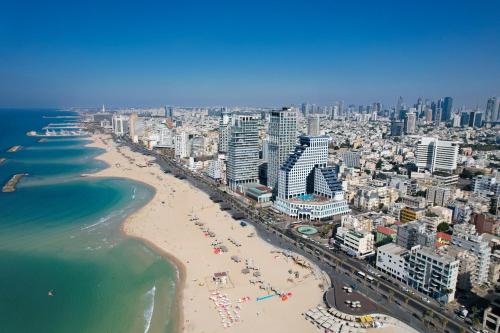 an aerial view of a beach and the ocean at The David Kempinski Tel Aviv in Tel Aviv