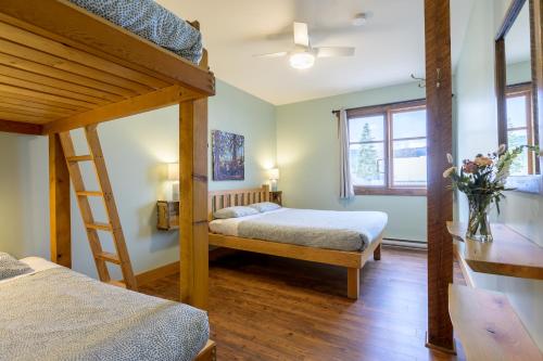 a bedroom with two bunk beds and a ladder at Riding Fool Accommodation in Cumberland