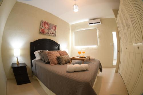 Postel nebo postele na pokoji v ubytování The Cozy Apartment