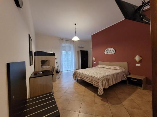 a bedroom with a bed in a room at B&B La Filanda in Scilla